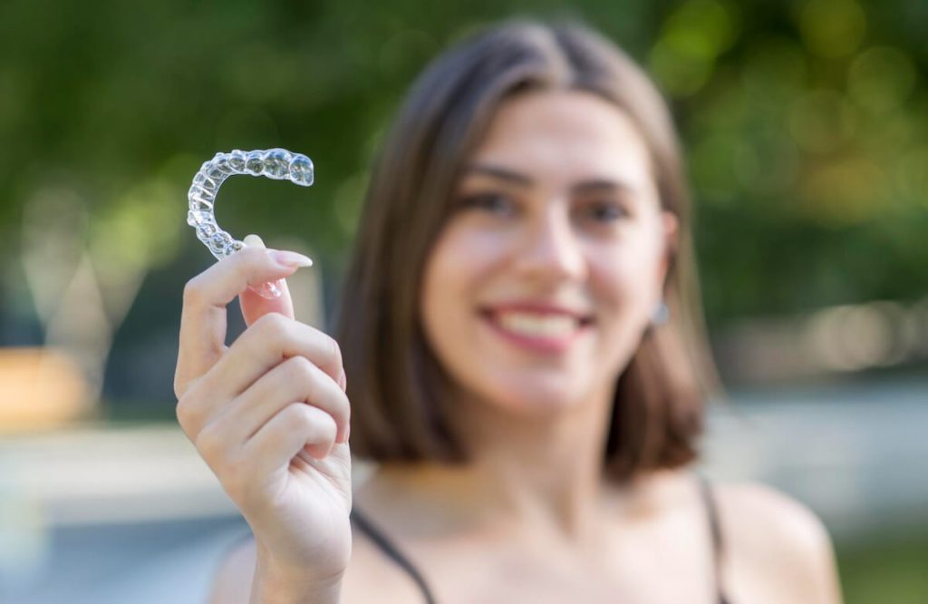 straightening your teeth with invisalign