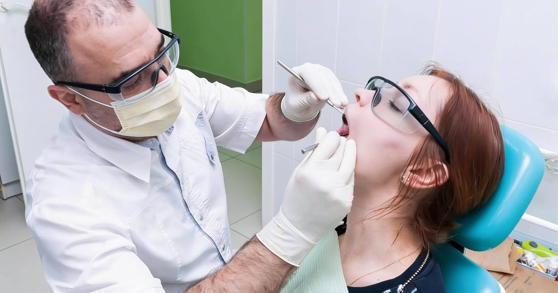 Dentist examining a patient's mouth in Yeronga